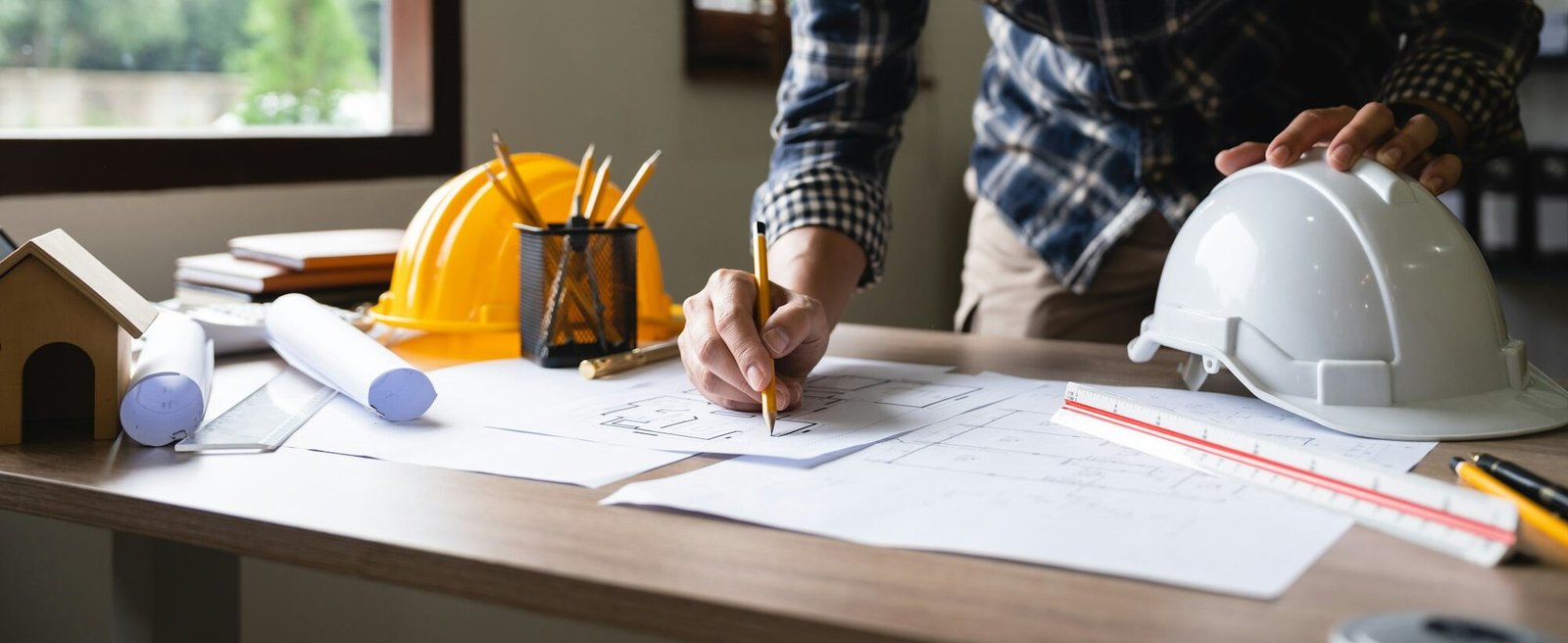 Engineer architect designer freelance work on start-up project drawing, construction plan